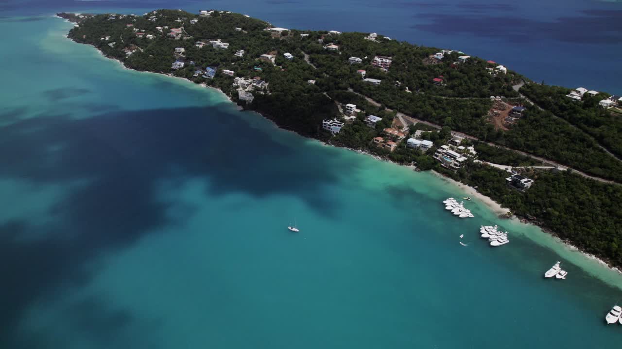 Amazing aerial view boats in water homes on mountain magen's bay st