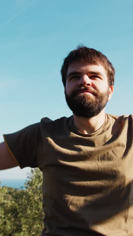 athlete does breathing exercises outdoors in nature
