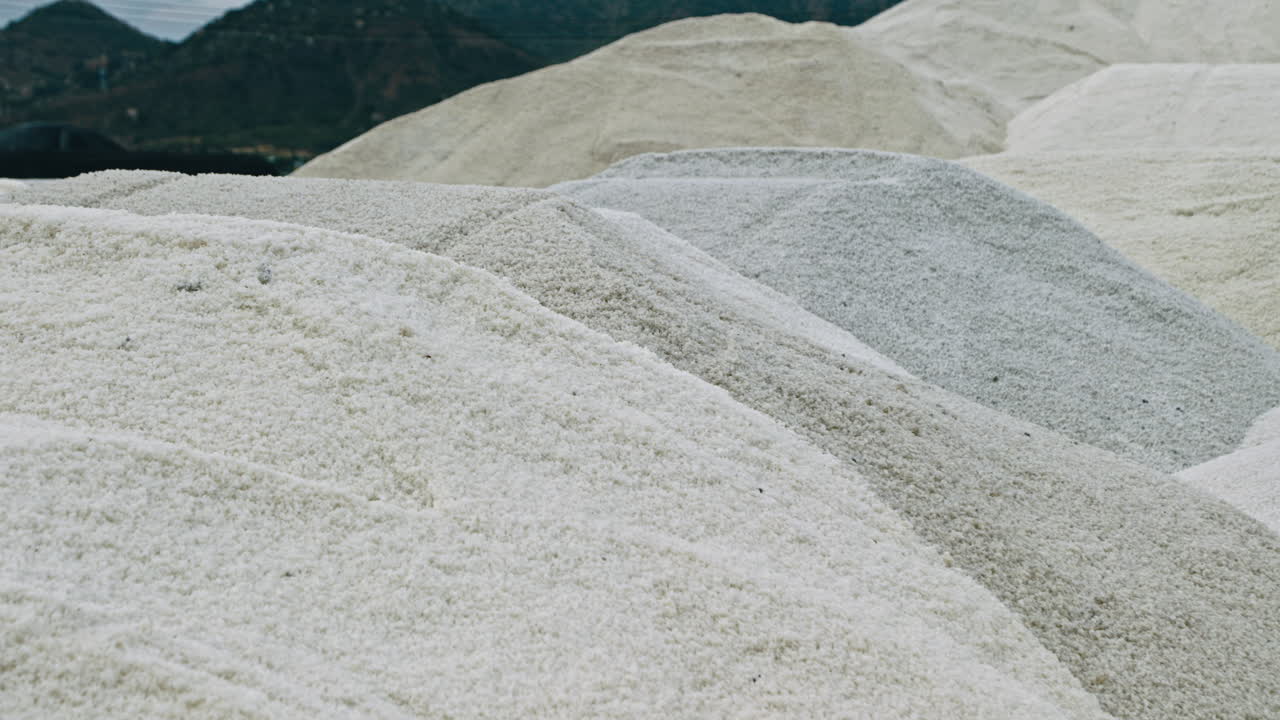 Large Piles of White Salt at an Industrial Site