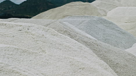 large piles of white salt at an industrial site