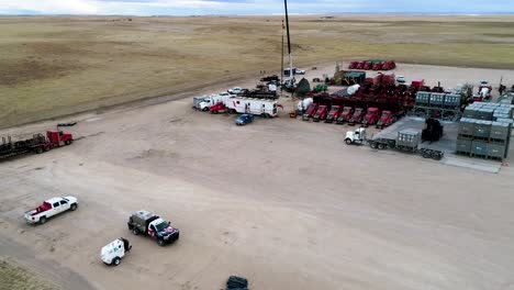 drone back up to reveal a large oil extraction operation on the plains of eastern colorado 2021