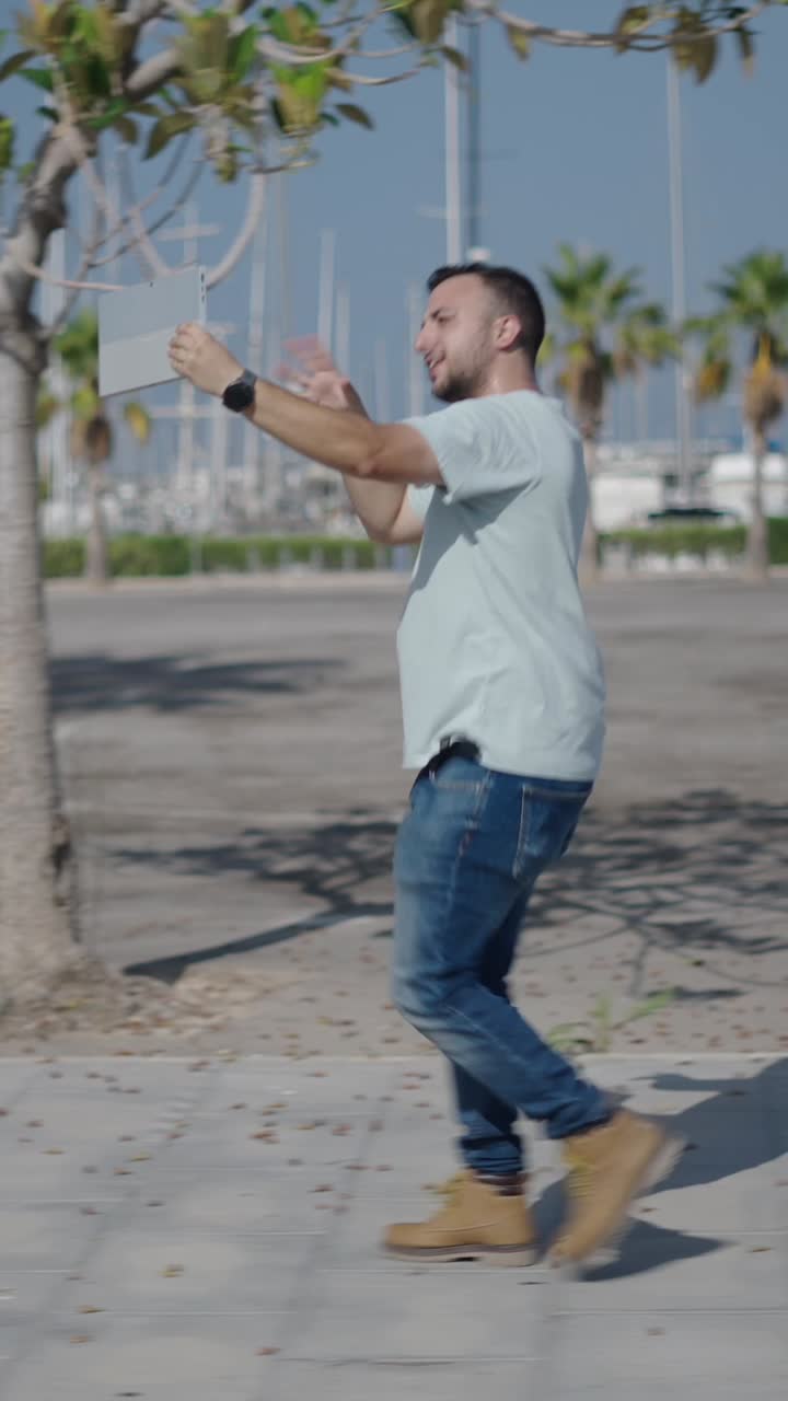 Man on a video call in a marina