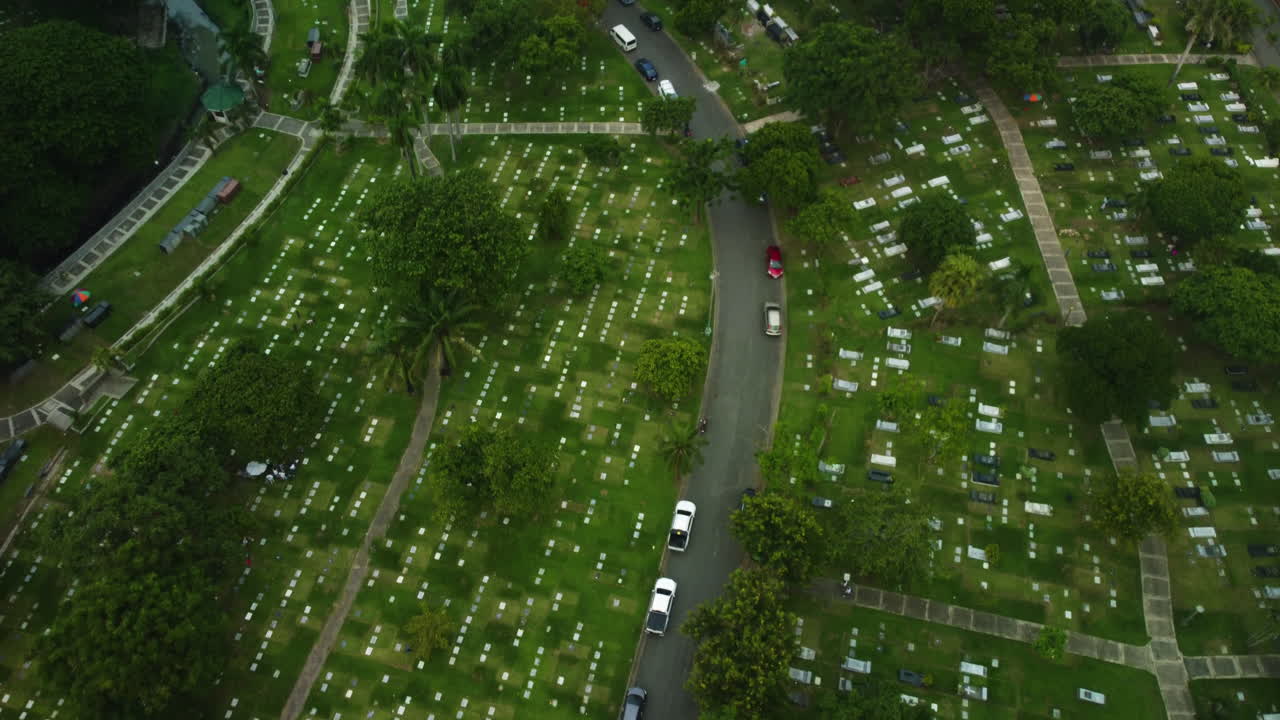 Drone overview of the Manila memorial park area, cloudy, summer day in Philippines