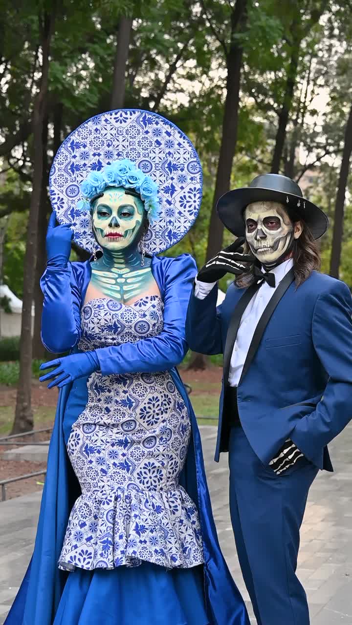 Day of the Dead, couple in vibrant outfits in the Alameda Central park during the Day of the Dead celebrations