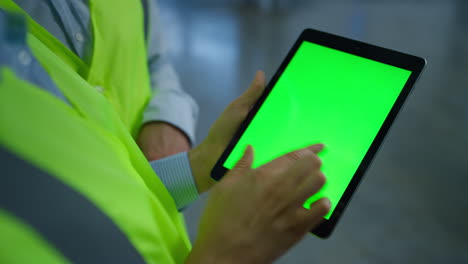 Factory-workers-checking-seen-screen-tablet-analysing-information-hands-closeup