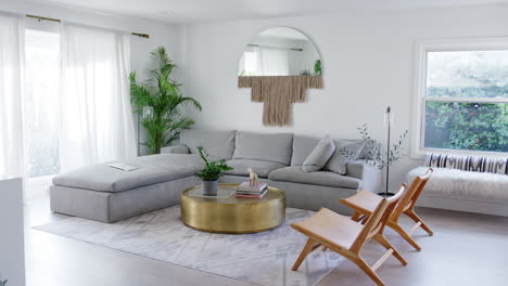 interior view of beautiful lounge with sofas and chairs in new family house