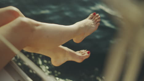 woman's legs and feet on a yacht deck