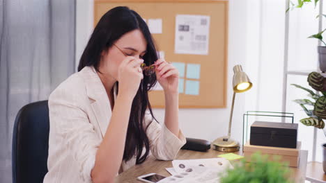 businesswoman reviews financial report, worried and devastated