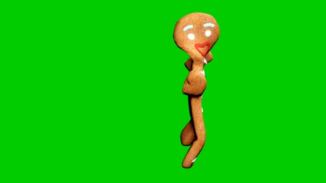 el hombre de pan de jengibre está bailando un baile de navidad. el concepto de la celebración. animación en bucle frente a la pantalla verde.