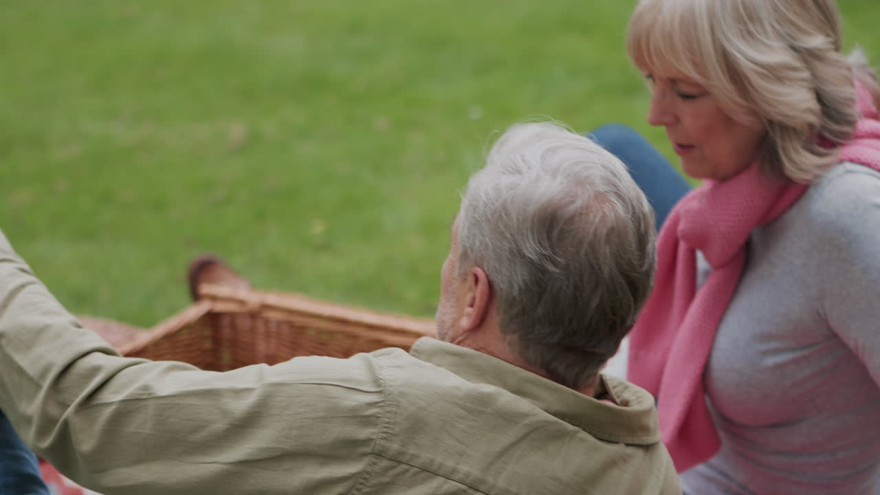 Senior couple enjoying a picnic outdoors