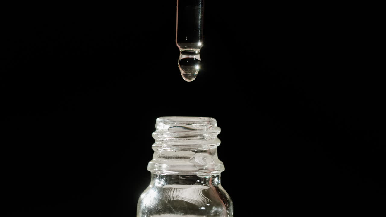 Dropper Filling a Glass Bottle