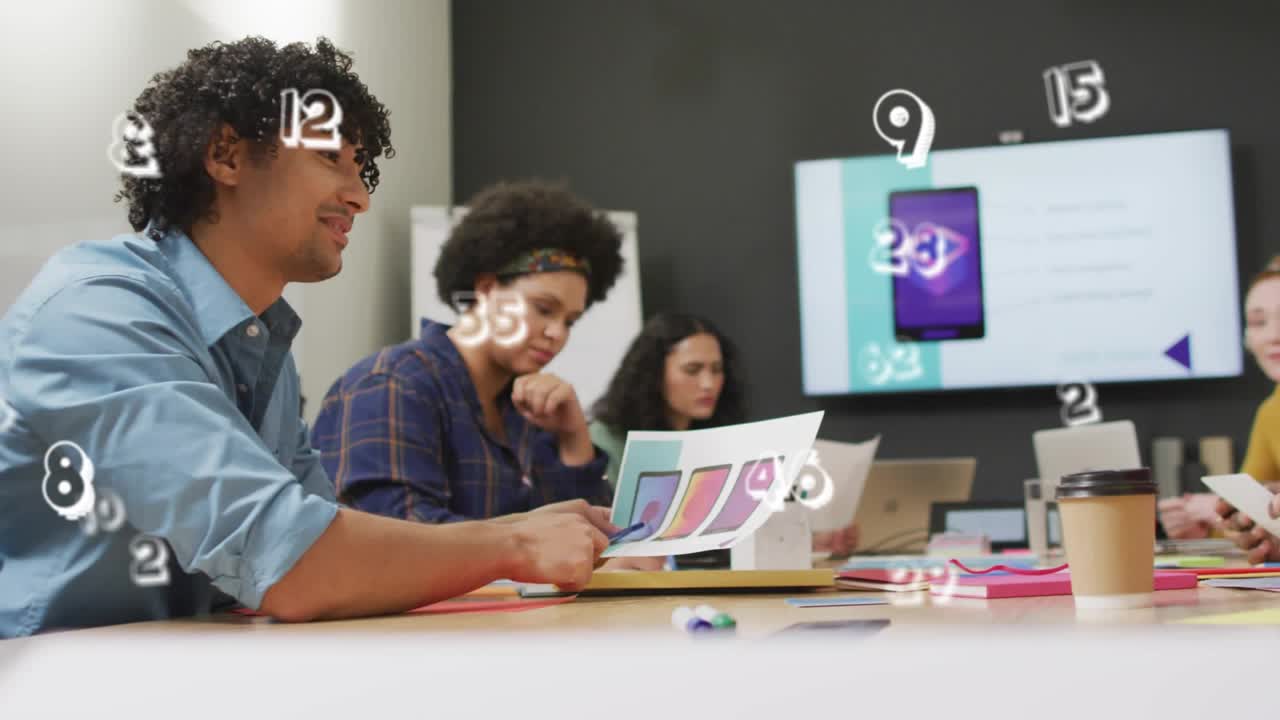 Designer retrieving swatches and guiding design review as numeric overlays drifting over table