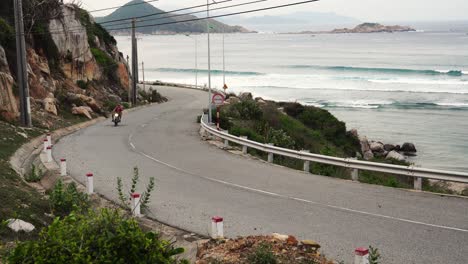 biker driving scenic road near bai chuoi and binh hung. nui chua national park. static