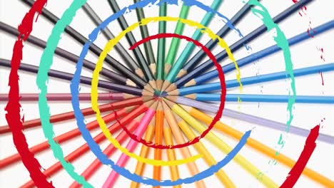 animation of multiple colourful moving circles and pencils on white background