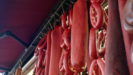 traditional turkish meat products hanging in a market