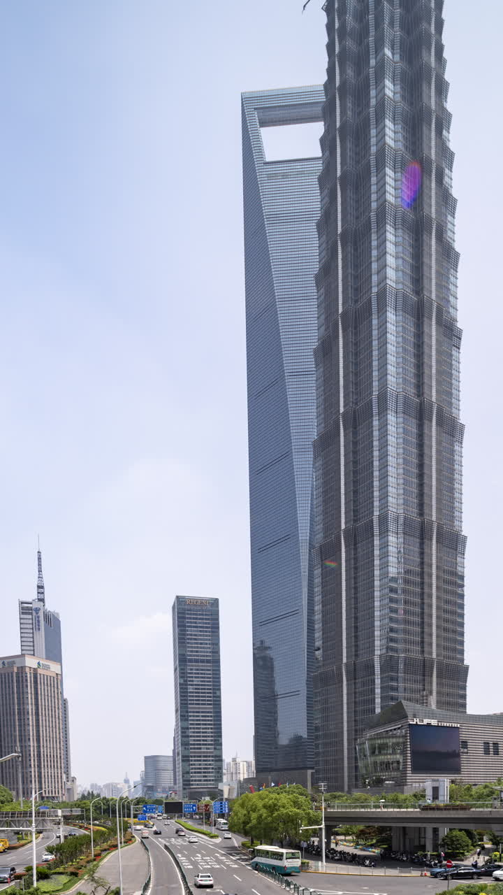 SHANGHAI, CHINA - 18 MAY 2025 : Timelapse of the Shanghai city skyline from a high vantage point at night in vertical