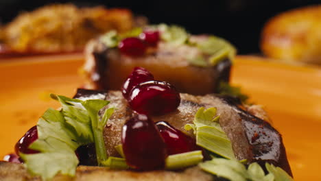 stuffed eggplant appetizer with pomegranate seeds