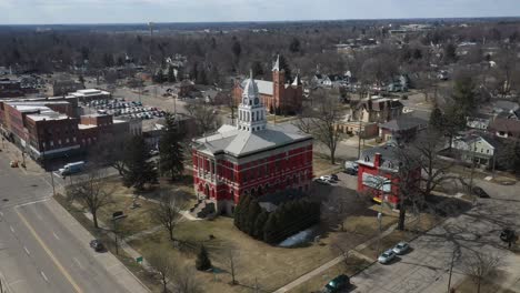 historic eaton county courthouse in charlotte, michigan with drone flying over side