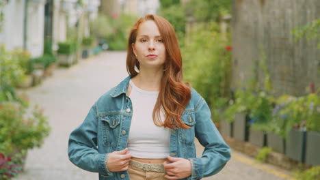 portrait of young female vlogger or social influencer travelling through city for social media