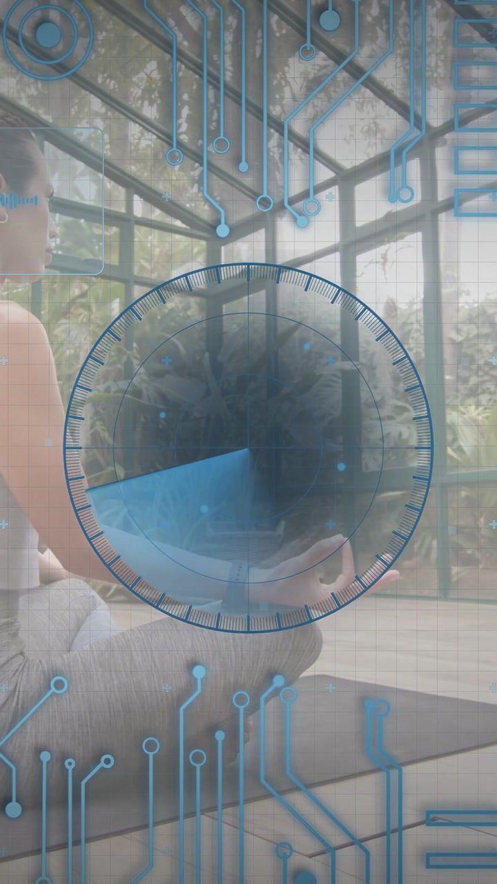 Vertical video: Woman sitting on yoga mat in sunroom, frame showing torso as HUD tracking health