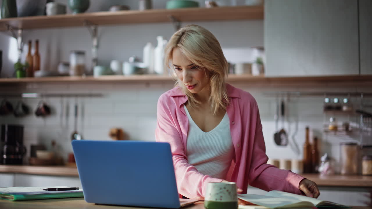 Clever girl flipping notebook kitchen closeup. Pensive woman making coffee sip