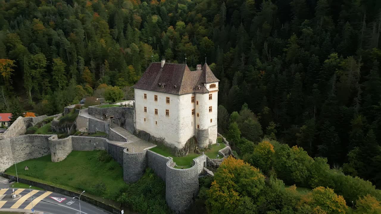 Orbit establishing drone shot of Valangin Castle in Canton of Neuchatel Switzerland