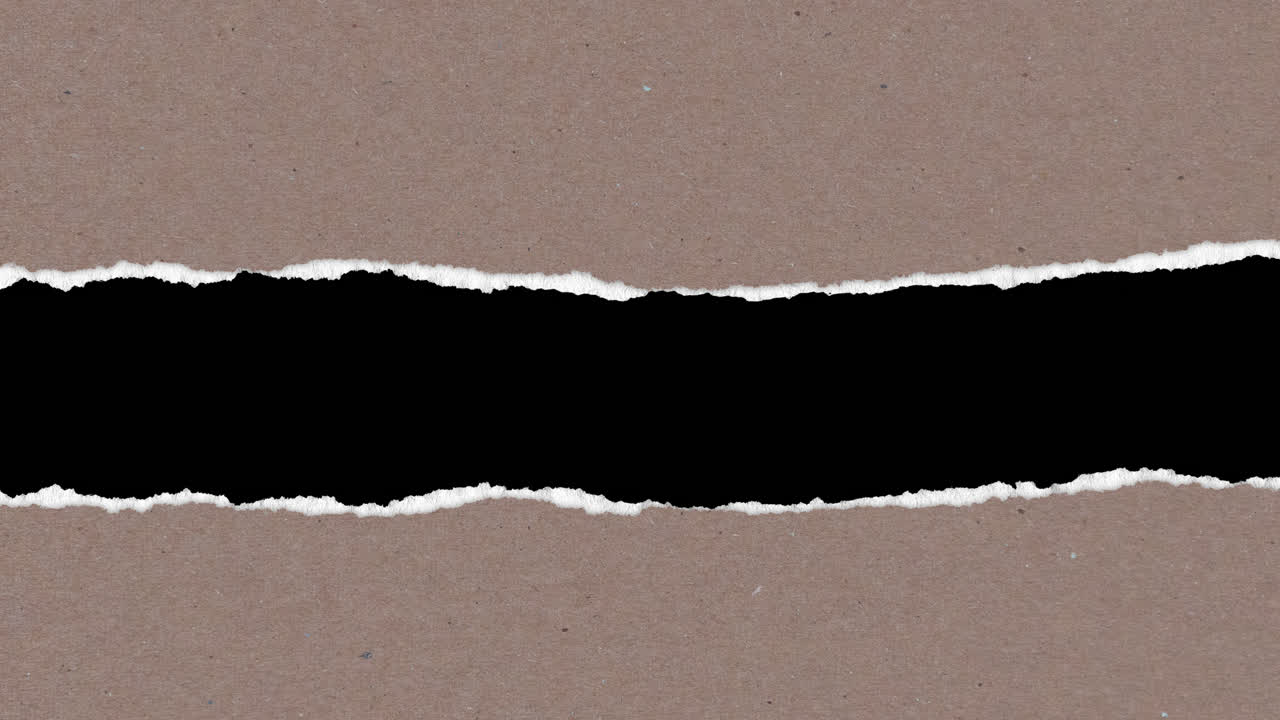 Brown Cardboard Paper Tearing to Reveal Black Background