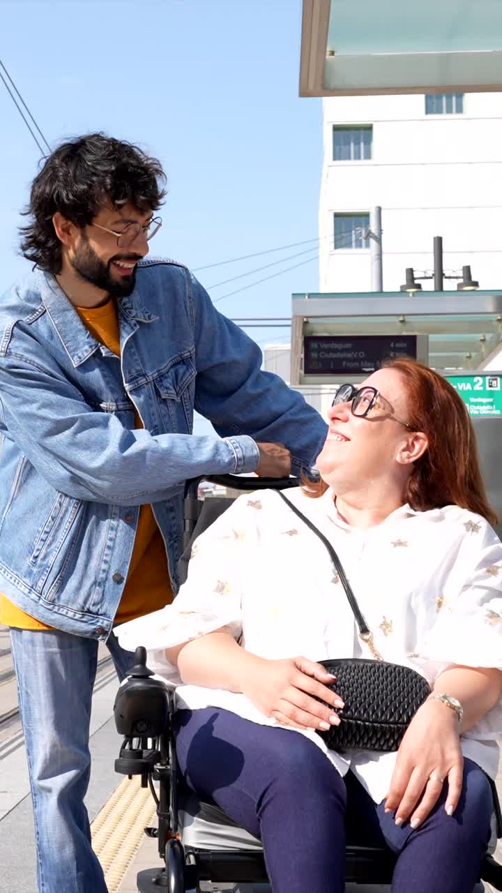 Assistance and Accessibility: People Using Wheelchair at Tram Station