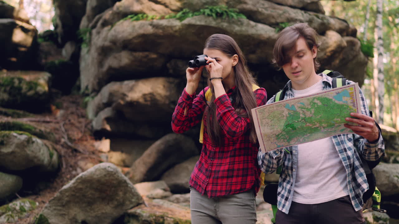 Couple Hiking and Exploring the Forest