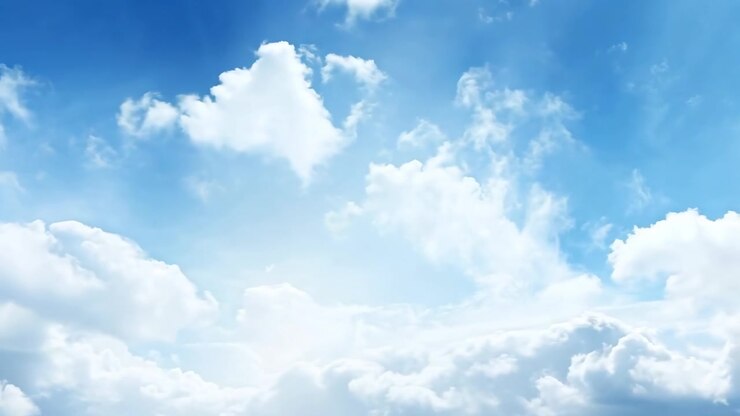 White Clouds Drifting Across a Bright Blue Sky