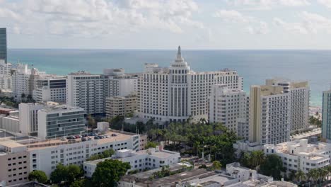 majestic white buildings of miami downtown, aerial orbit view