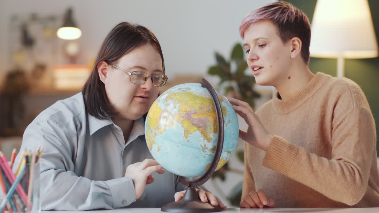 Two people learning geography