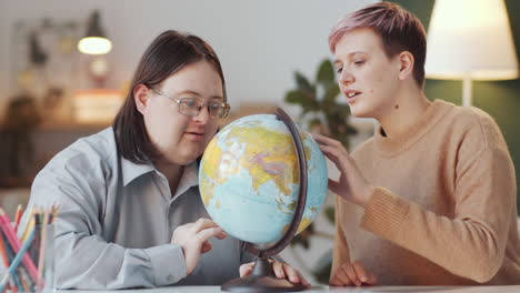 two people learning geography