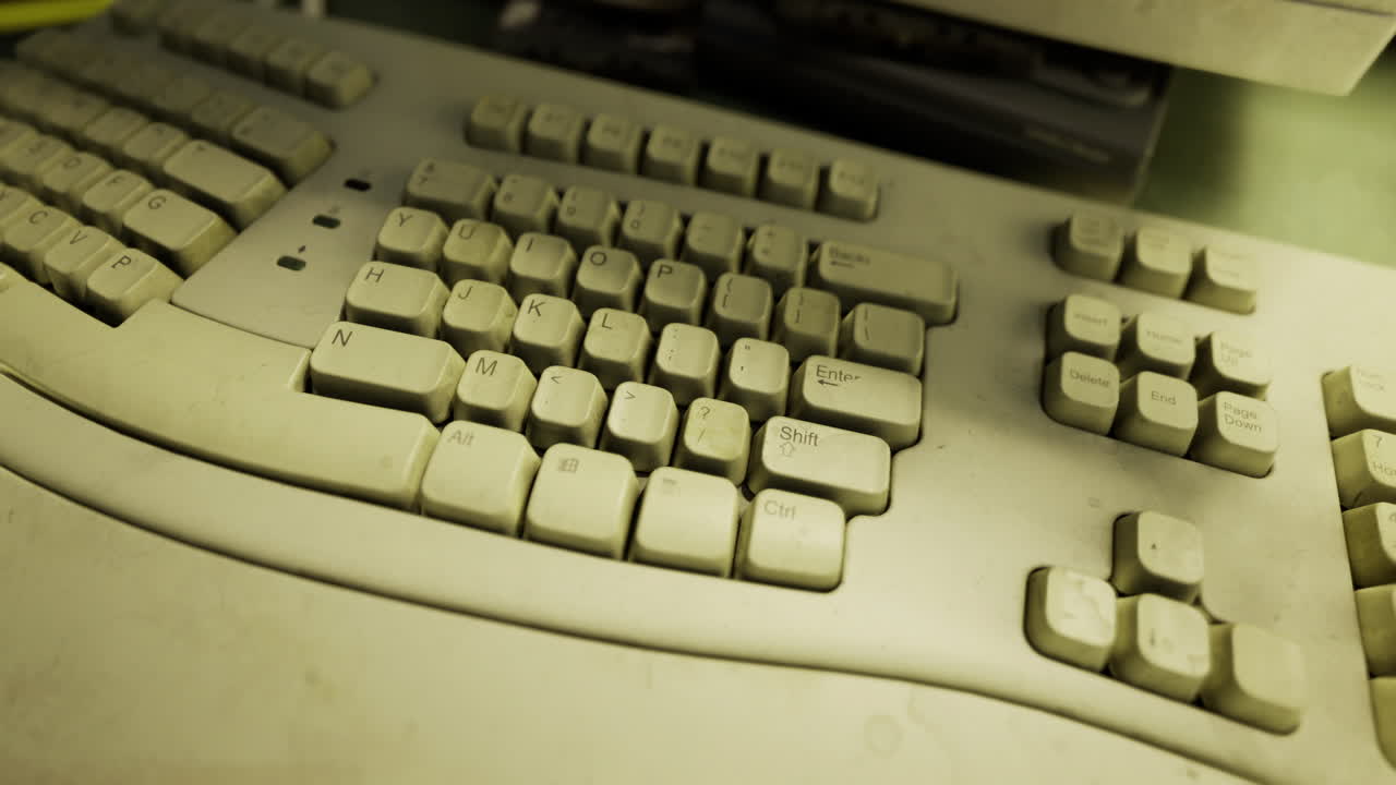 Old keyboard covered in dust reveals forgotten technology from the past