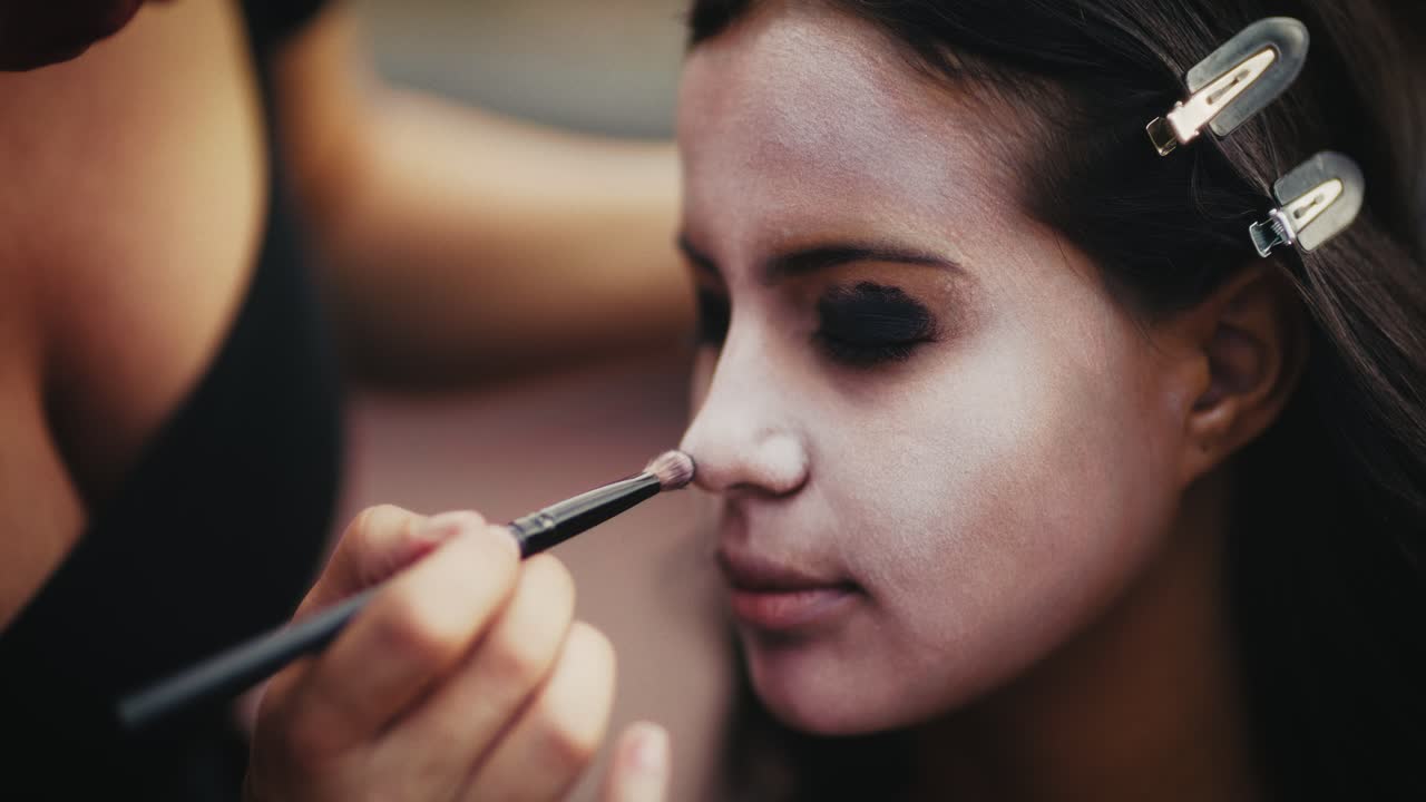 Woman Getting Halloween Face Paint