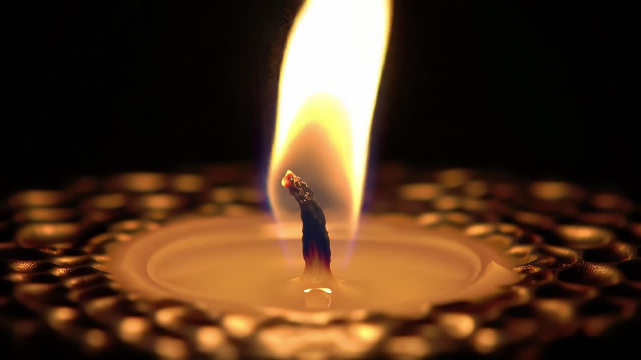 A Captivating Close-Up of a Flickering Candle Flame with a Soft Glow, Illuminating a Dark Background, Creating a Serene and Calming Atmosphere