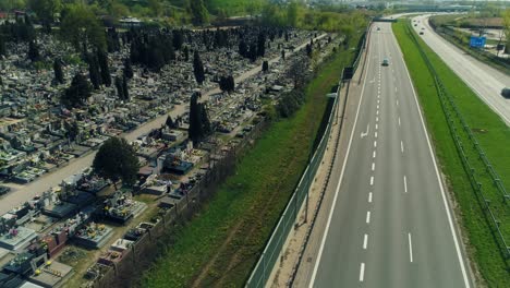 aerial view of a cemetery by multiple lane highway