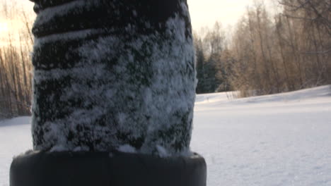 Super-close-up-of-winter-boot-walking-into-deep-snow