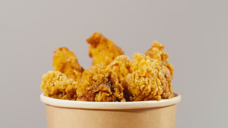 crispy fried chicken in a paper cup