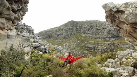 Male-hiker-relaxing-in-hammock-4k