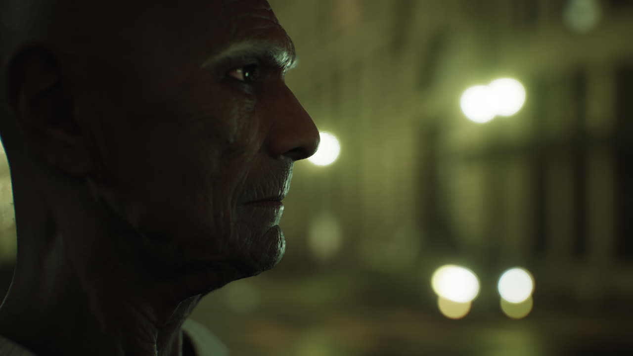 old asian man in big city at night