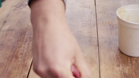 applying stain or polish to wooden table