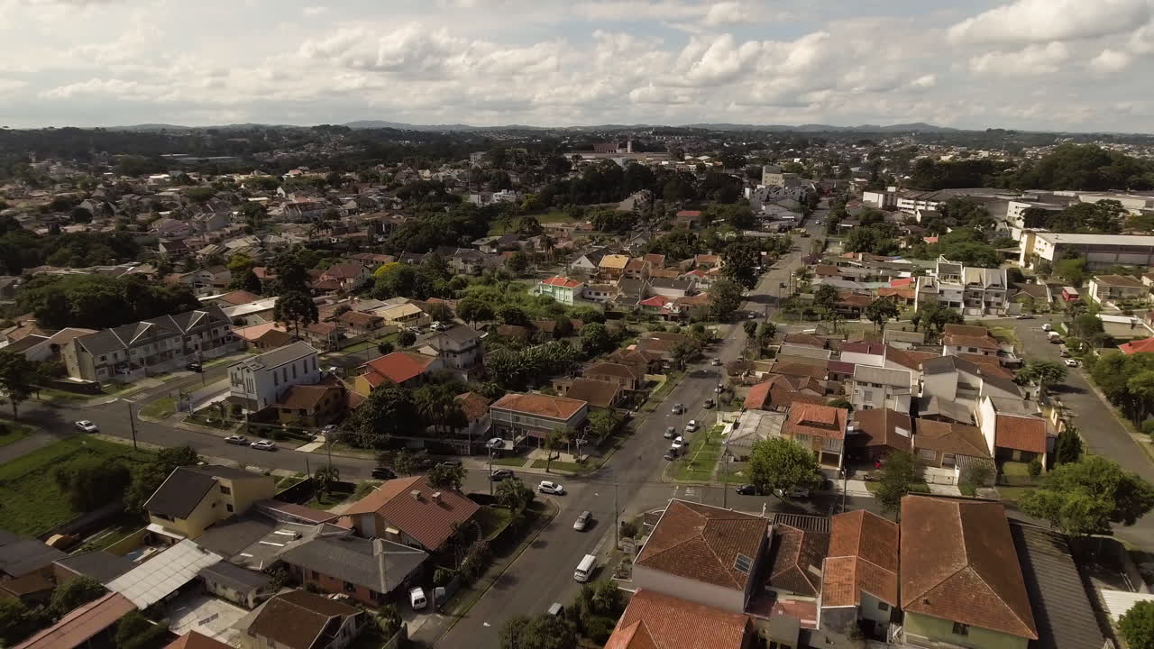 Aerial view of a residential area with various houses and buildings