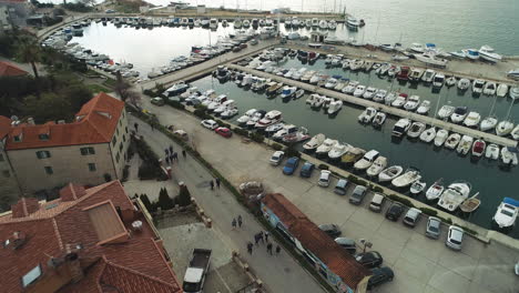 aerial descending view over small boats in marina, split, croatia