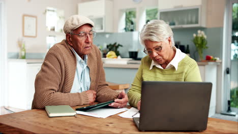 senior couple using technology at home