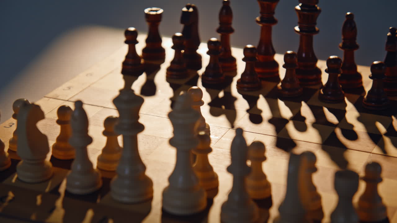 Game pieces standing chessboard closeup. Figures show tactical power in sunlight