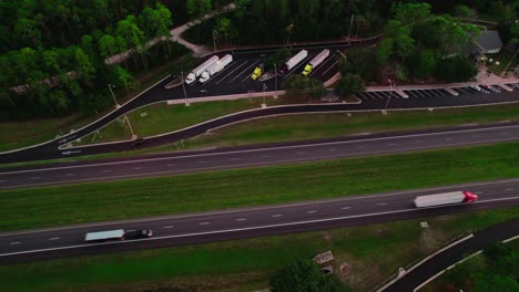 semi truck rest area in florida with highway, long-haul truckers and travelers passing through the sunshine state