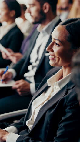 professional woman smiling at a business event