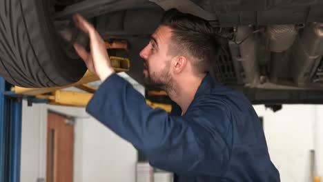 mechanic working on a tire