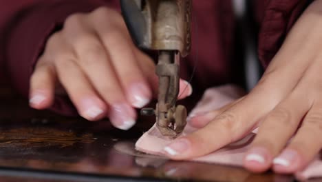 close up of the needle of a sewing machine while in operation